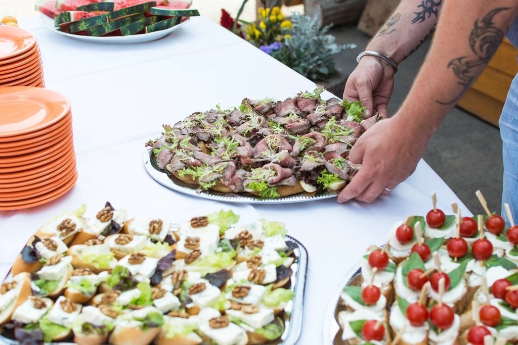 Platters of food being arranged for an event